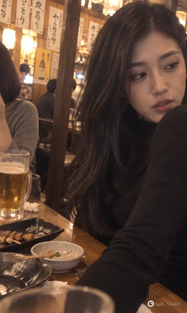 A casual, grainy vertical photo of a young woman seated at a wooden izakaya table with dishes.